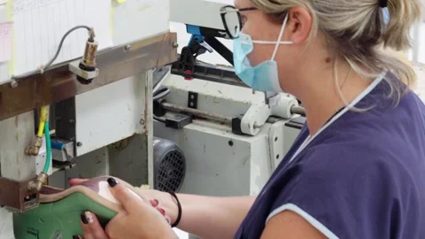 Shoe Factory - Shoes making process with worker Stock Footage 136729745