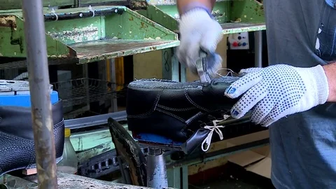 Shoe factory worker makes shoes Stock Footage 79727069