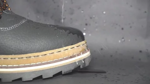 Shoe with falling drops Stock Footage 98795300