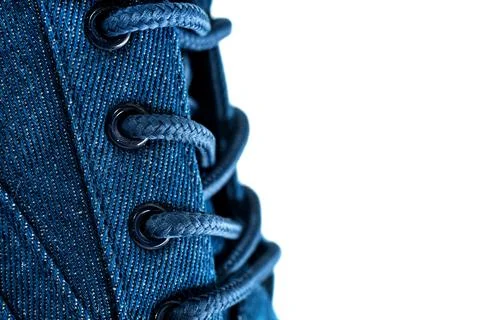 Shoe laces. Lace-up casual or sports shoes close-up on a white background. Stock Photos