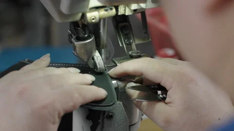 Shoe Manufacturing Process with Worker Sewing Leather Pieces in Industrial Stock Footage 341668916