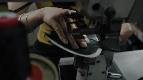 Shoe Manufacturing Worker Sewing Material with Industrial Machine in Factory Stock Footage 341668568