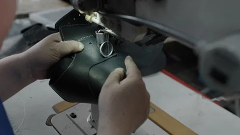 Shoe Production Worker Sewing Leather Upper with Industrial Machine in Workshop Stock Footage 341668295