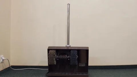 Shoe Shine machine, press the power button and the brushes start to rotate Stock Footage 103677137