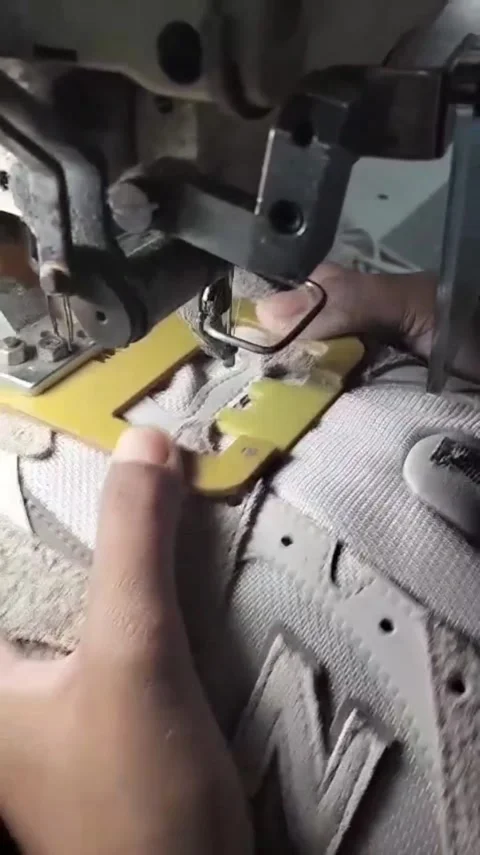 Shoe Upper Manufacturing Process Using Industrial Sewing Machine Stock Footage 345069865