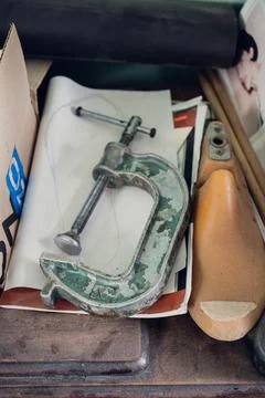 In the shoe workshop, insoles, boot blanks, fasteners, and drawings are placed Stock Photos