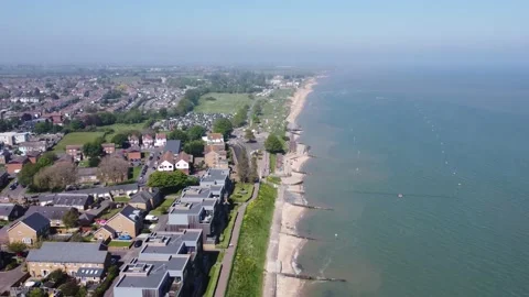 Shoebury beach high elevation descending shot, hazy sunshine, 4K UHD Video stock 169054524