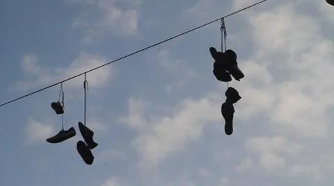 Shoefiti - shoes on power line 2/2 Stock Footage