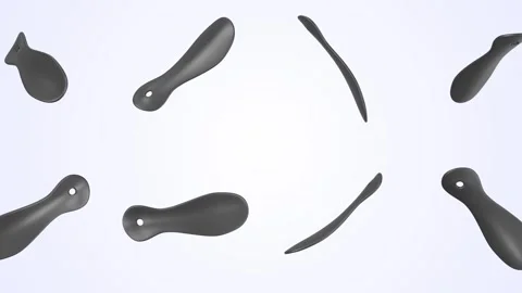 Shoehorn Falling on a Light Blue Background. Shoe Spoon 3D Animation. 4K Stock Footage 310010484