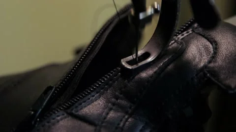 Shoemaker fixing shoe in his workshop Stock Footage 130859043