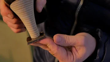 Shoemaker glues the sole on the heel of a woman's shoe Stock Footage 85525516