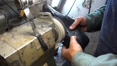 Shoemaker hones taps on the machine Stock Footage 77918370