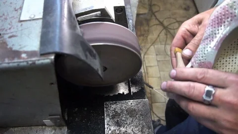 Shoemaker hones taps on the machine Video stock 77922656