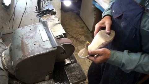 Shoemaker hones taps on the machine Stock Footage 77922815