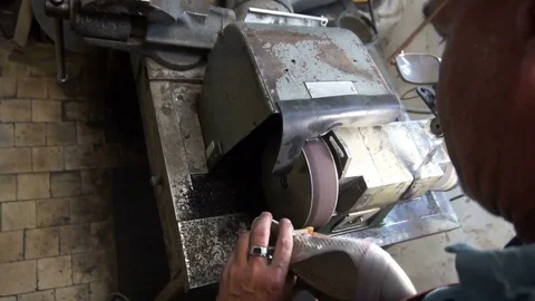 Shoemaker hones taps on the machine Stock Footage 77922952