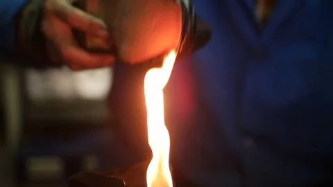 Shoemaker making shoes. Working with fire at cobbler workshop. Close up view. Stock-Footage 71254122