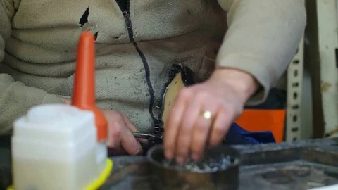 Shoemaker making shoes. Working with nails at cobbler workshop. Close up view. Stock-Footage 71251153
