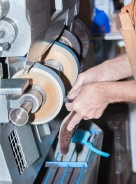 The shoemaker repairs a shoe Stock Photos