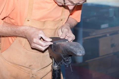 The shoemaker repairs a shoe Stock Photos