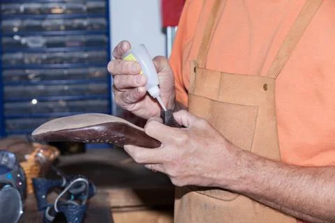The shoemaker repairs a shoe Stock Photos