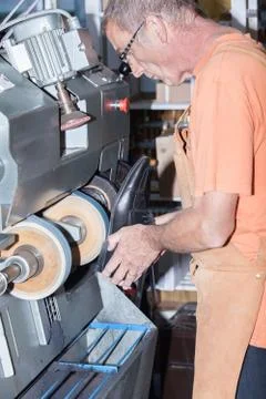 The shoemaker repairs a shoe Stock Photos