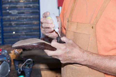 The shoemaker repairs a shoe Stock Photos