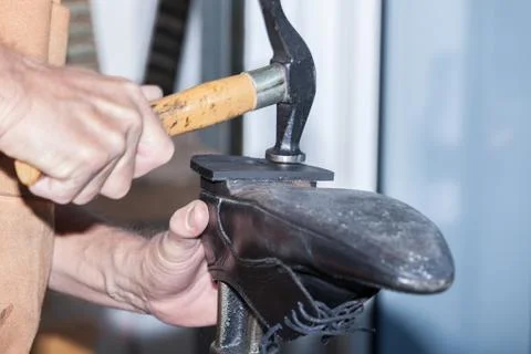 The shoemaker repairs a shoe Stock Photos