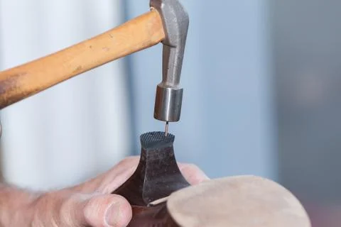 The shoemaker repairs a shoe Stock Photos