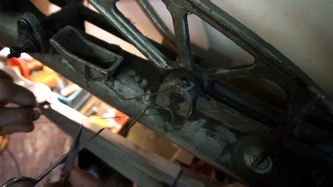 Shoemaker replaces spools of thread on the machine Stock Footage 77871702