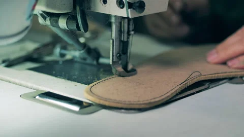 Shoemaker sewing the sole of a shoe. Close up Video stock 141424457