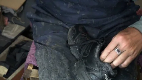 The shoemaker at work.The process of repairing shoes in workshop Stock Footage 77919571