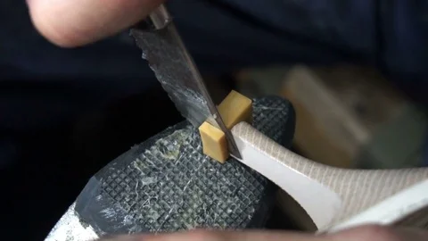 The shoemaker at work.The process of repairing shoes in workshop Stockbeeldmateriaal 77922411