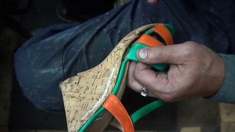 The shoemaker at work.The process of repairing shoes in workshop Stockbeeldmateriaal 77923296