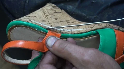The shoemaker at work.The process of repairing shoes in workshop Stock Footage 77923442
