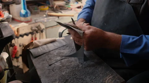 Shoemaker working, fixing an old shoe, manually, artisan, fa01 Видео 244588587