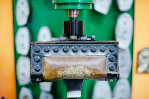 Shoemaker workshop machine to reshoke shoes Stock Photos