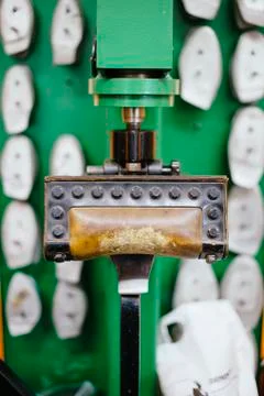 Shoemaker workshop machine to reshoke shoes Stock Photos