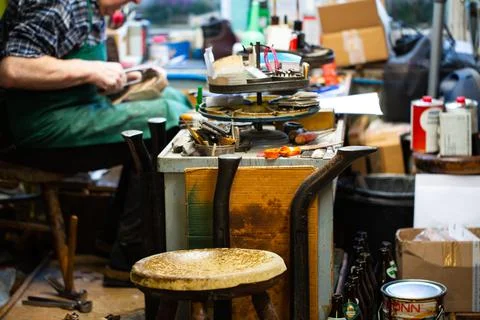 Shoemaker workshop with master shoemaker, old-fashioned workshop, orthopedic Stock Photos
