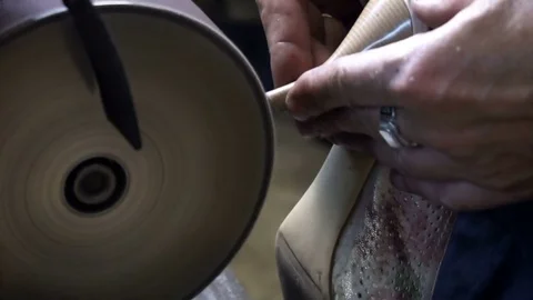 The shoemaker's sharpening metal taps on the machine Video stock 77917245