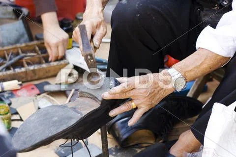 Shoerepairman Stock Photos
