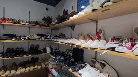 Shoes and props on the props rack in the photography studio Stock Footage 300206130