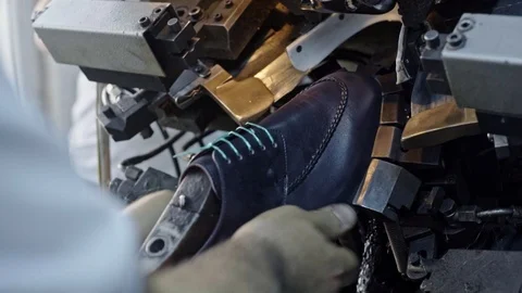 Shoes are putted in the mold to take a final form Stock Footage 123414488
