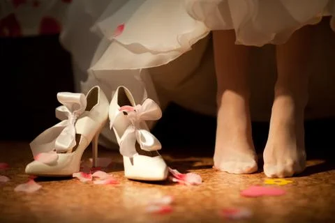 Shoes of the bride Stock Photos