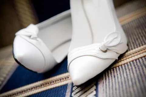 Shoes of the bride Stock Photos