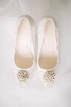 The shoes of the bride. Stock Photos