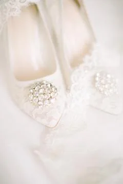 The shoes of the bride. Stock Photos