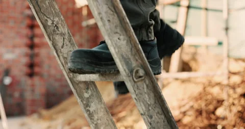 Shoes, construction worker and walking on ladder for building development Stock Footage 336226847
