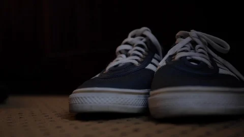 Shoes in Dark Locker Room Stock Footage 113408258