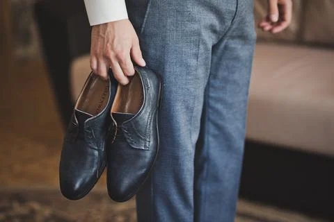 Shoes in the hands of men 1931. Stock Photos