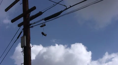 Shoes Hanging On Wire wide Stock Footage 1067701